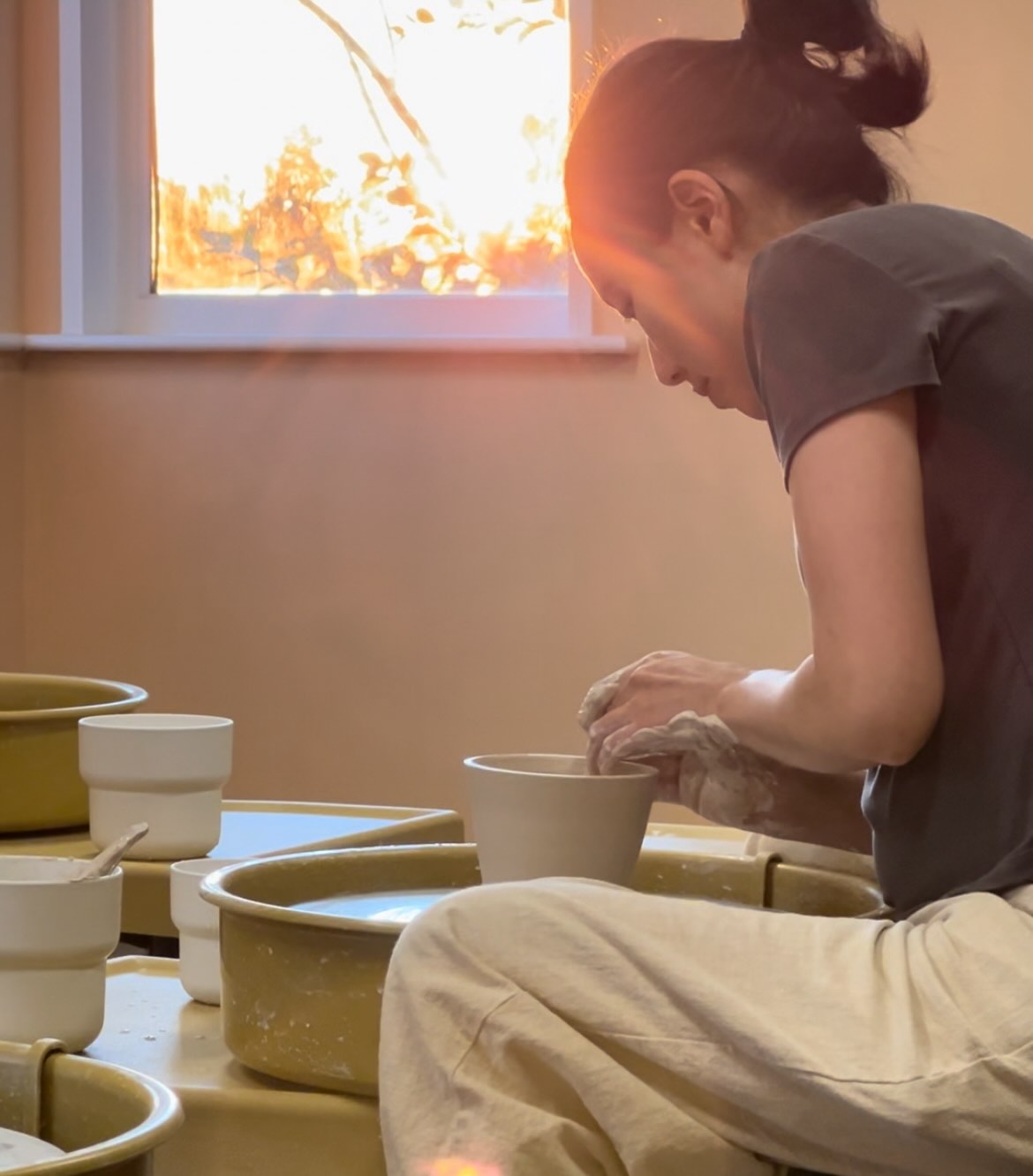 Adults enjoying pottery class in Irvine
